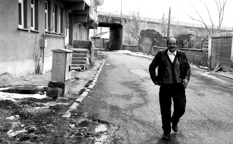 Old Man Walking On Decay Street