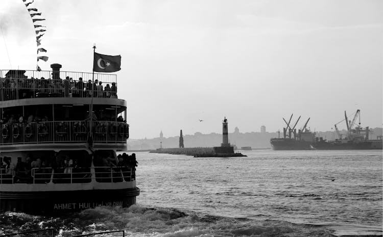 Grayscale Photo Of Ship On Sea