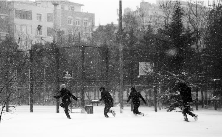 People Running In The Snow 