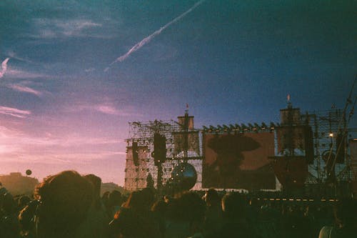 Crowd Heads near Installation at Sunset