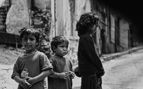 Free Black and White Photograph of Children on a Street Stock Photo