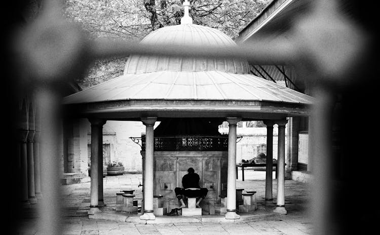 Person Sitting In Temple