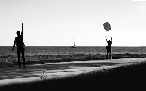 Man and Woman Flying a Kite