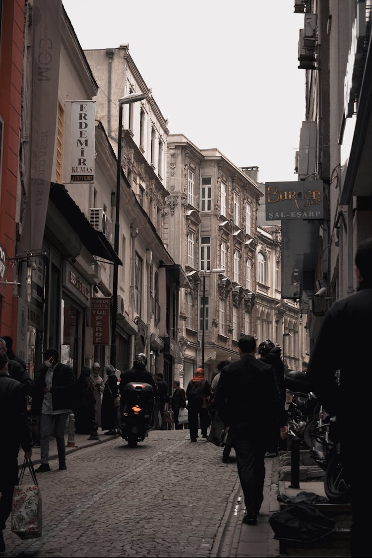 People Walking On Street Near The Buildings