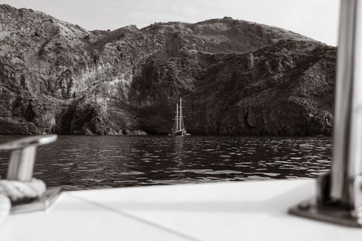 White Boat on Water Near Brown Mountain