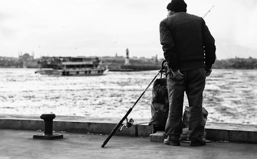 Man Fishing on a Pier 