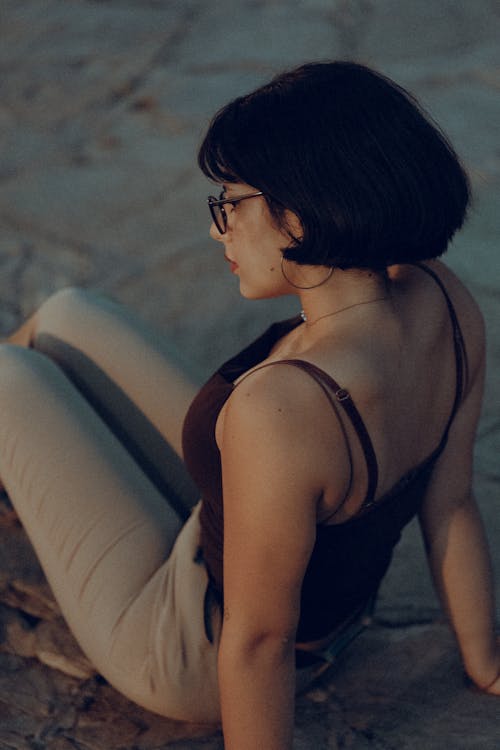 Woman Sitting on the Ground