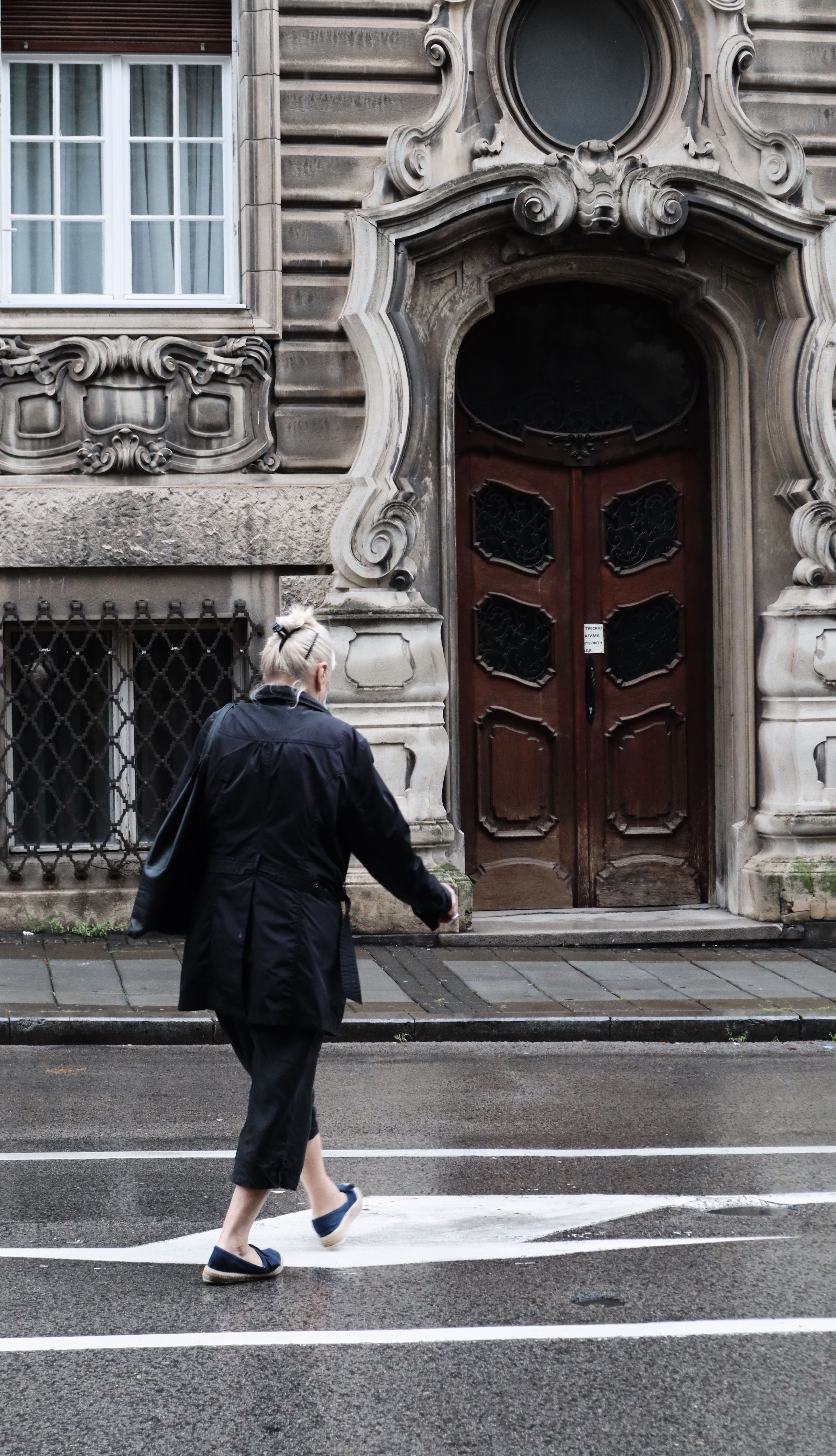 A Woman in Black Coat Walking on Street · Free Stock Photo