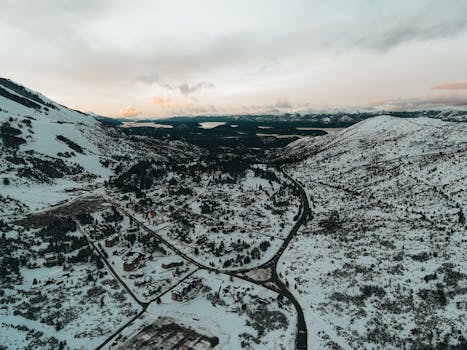 Breathtaking aerial view of snow-covered Villa Cerro Catedral, Argentina. Captures the essence of serene winter landscapes.