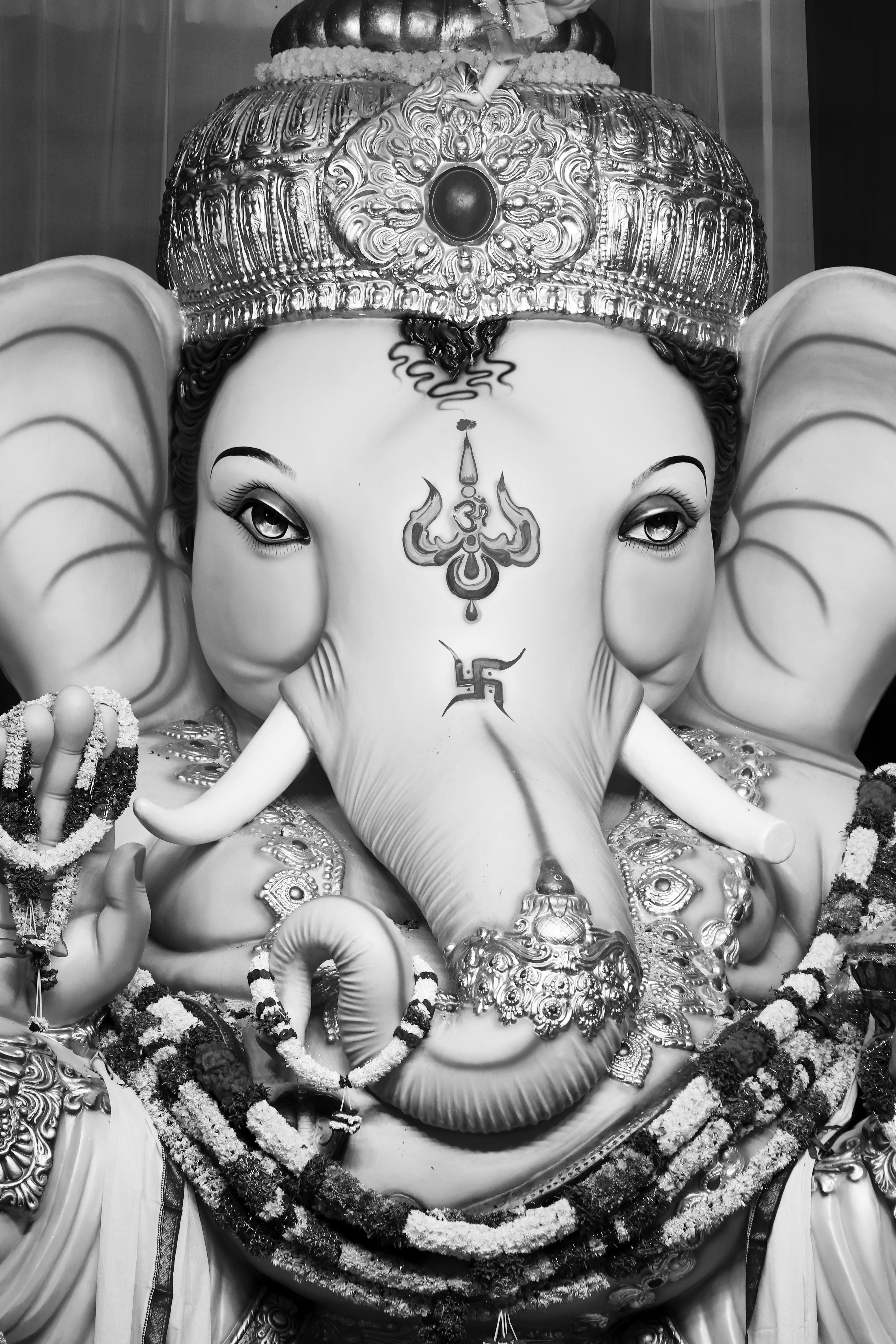 Grayscale Photo of Ganesha Decorated with Flowers · Free Stock Photo