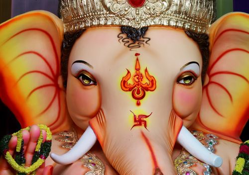 Free A vibrant close-up of a Ganesha idol showcasing detailed artistry and traditional symbolism. Stock Photo