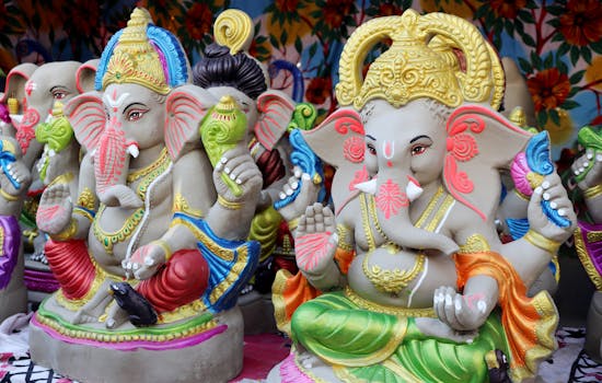 Vibrant and detailed sculptures of Hindu deity Ganesha on display.