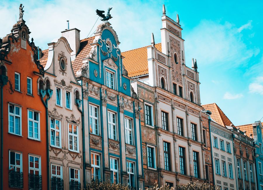 Vibrant Gothic architecture of historic facades in Gdańsk, showcasing iconic European style.