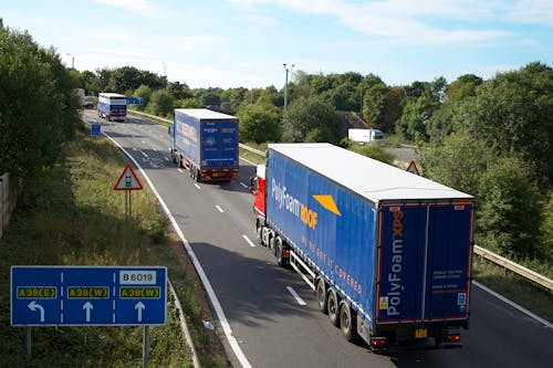 A Cargo Trucks Moving on the Road 