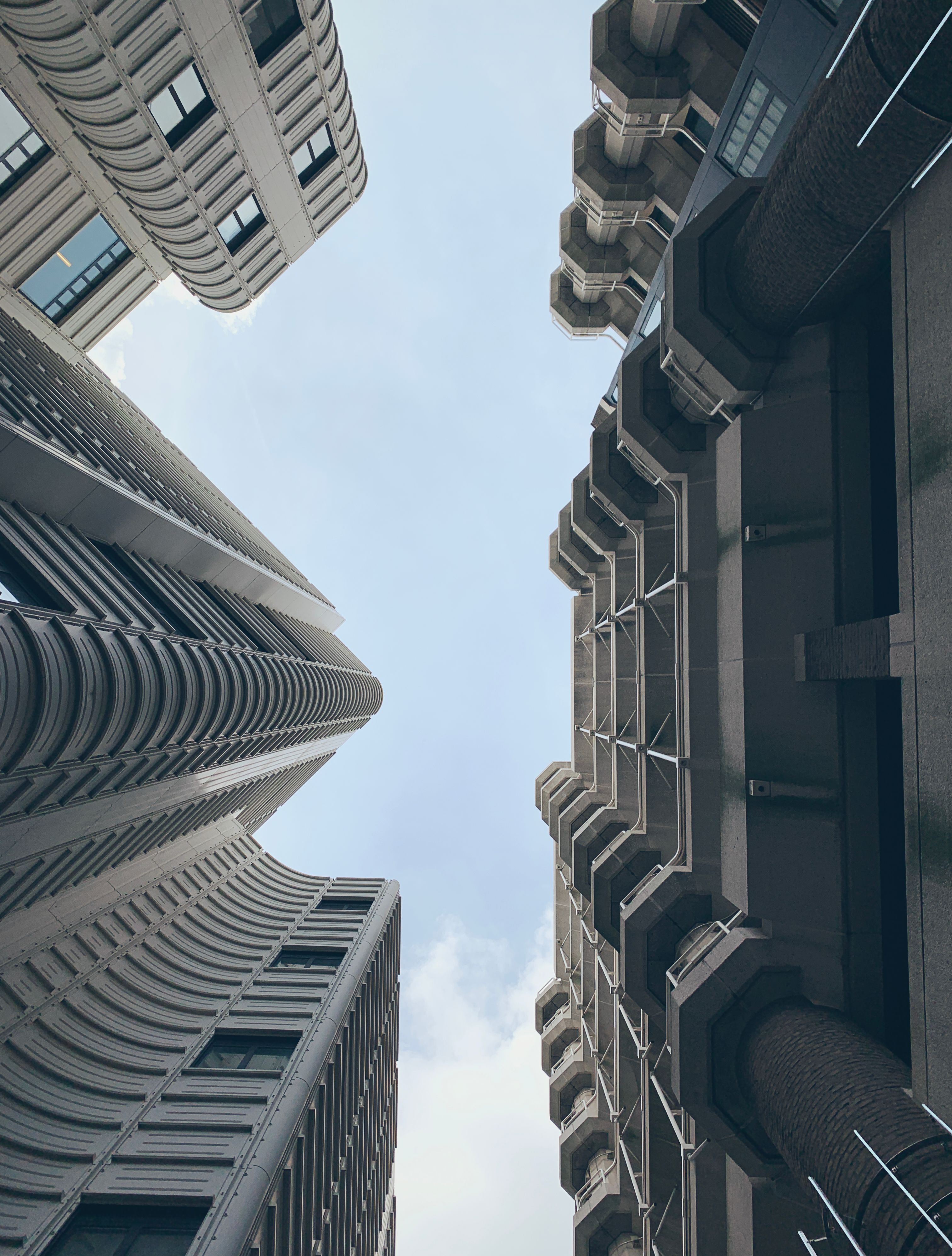 Low Angle Shot of Brown Concrete Buildings under Blue Sky · Free Stock ...