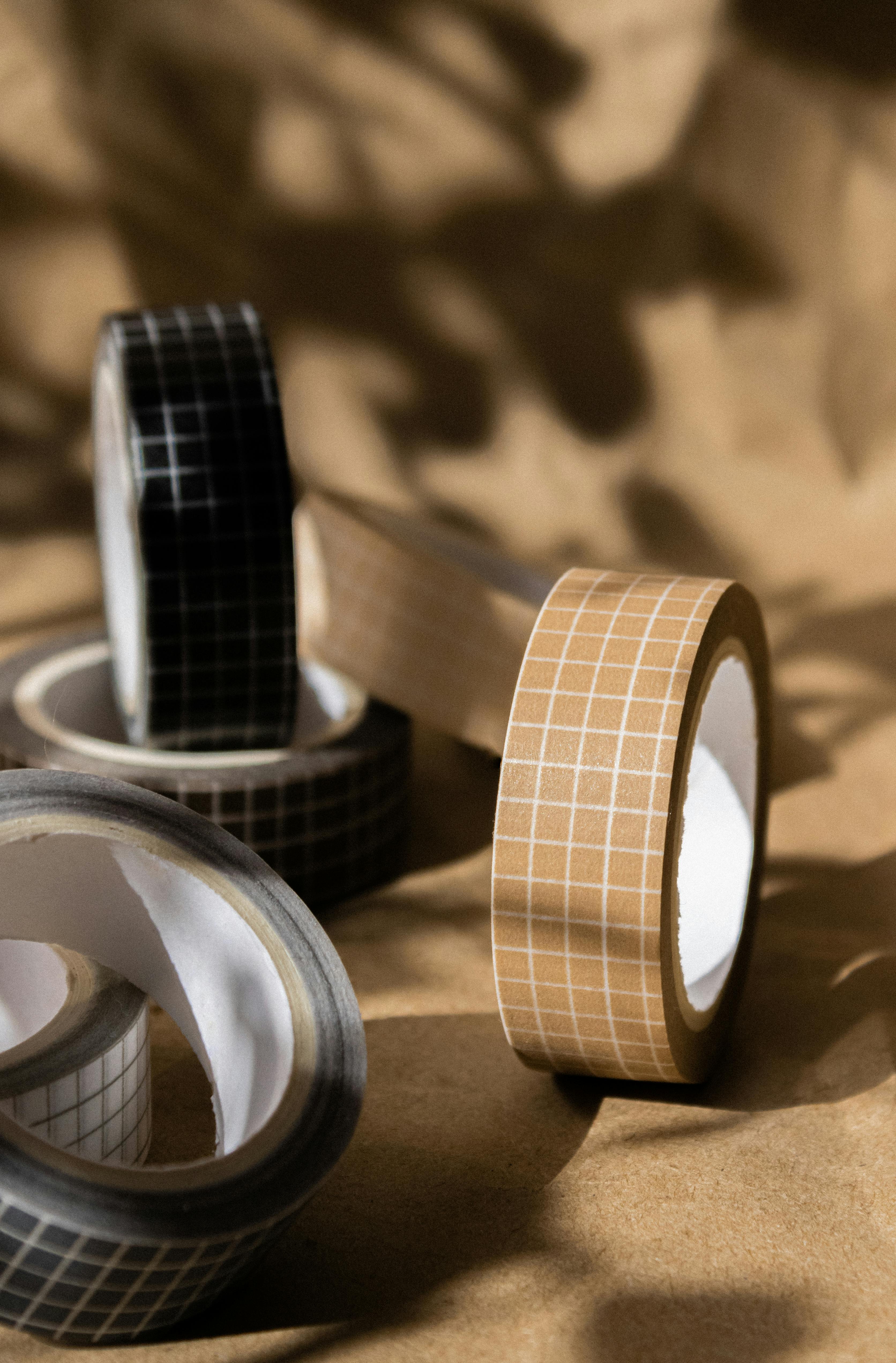 rolls of tapes on brown paper background