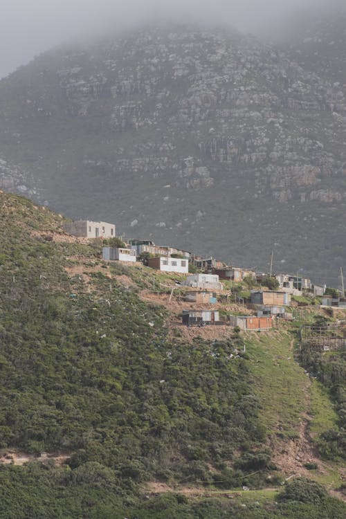 White and Brown Houses on Top of Mountain