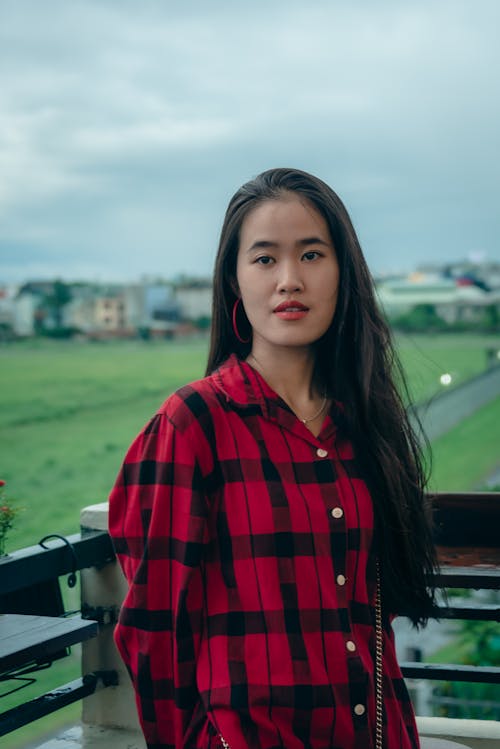 Cute asian girl with long hair on the balcony