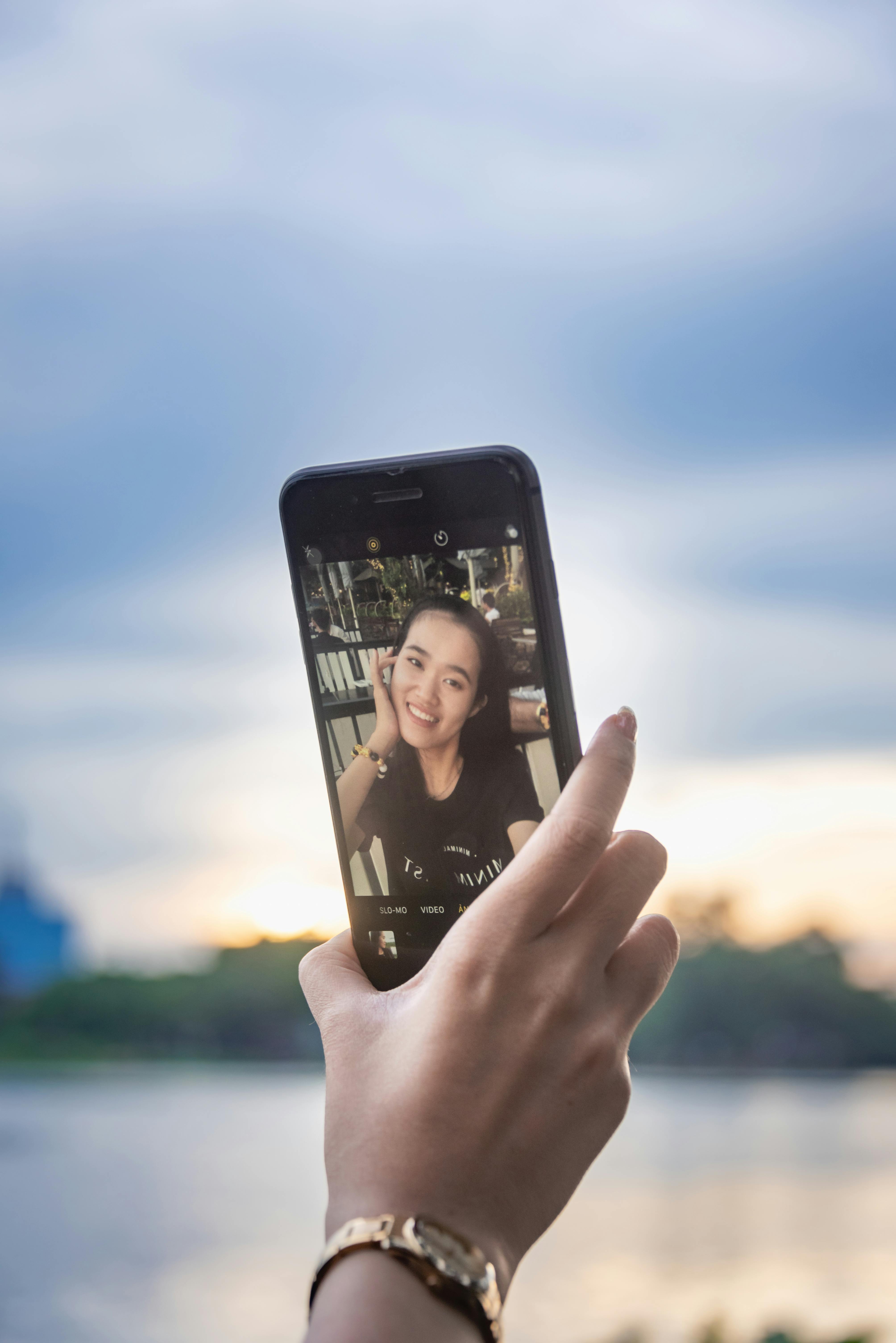 Woman Holding A Smartphone · Free Stock Photo