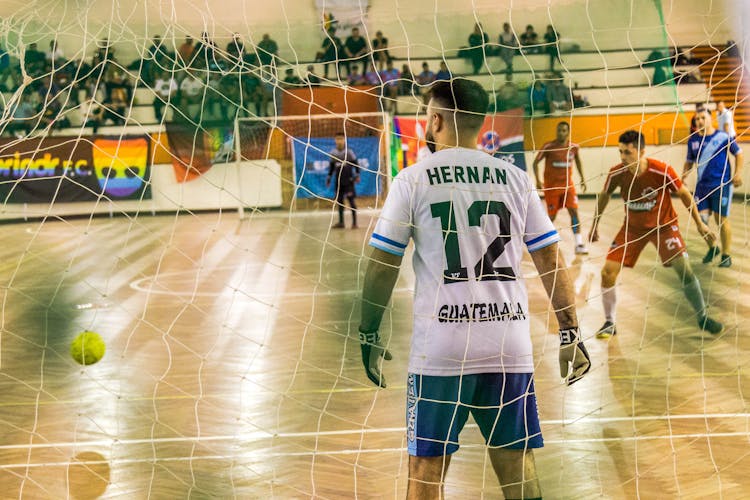 Men Playing Indoor Soccer