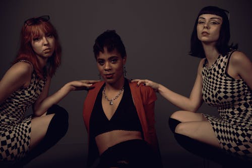 Three Young Fashionable Women Posing 