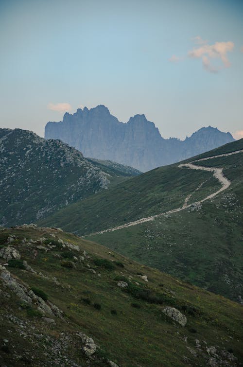 A Green Mountains Under the Blue Sky and White Clouds