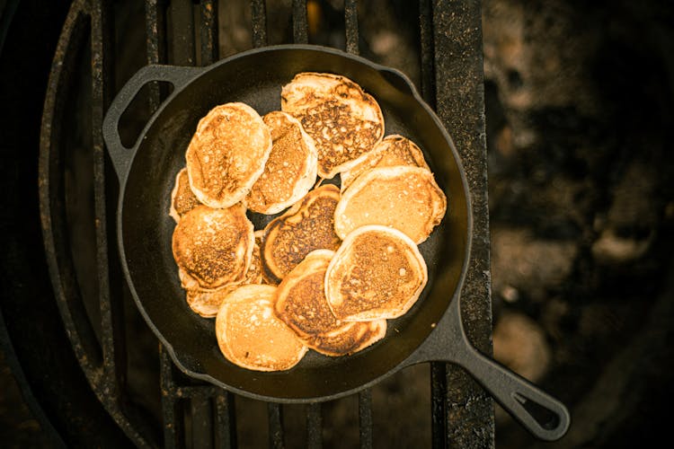 A Cooked Pancakes On A Frying Pan