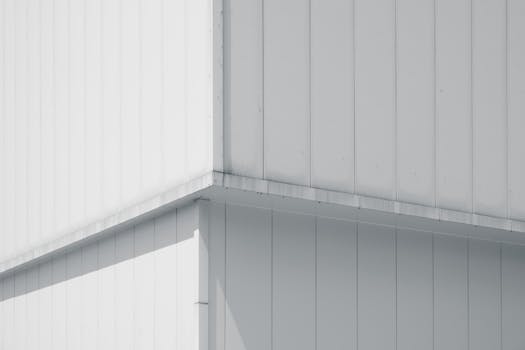 A minimalist capture of a building's geometric corner with subtle shadows.