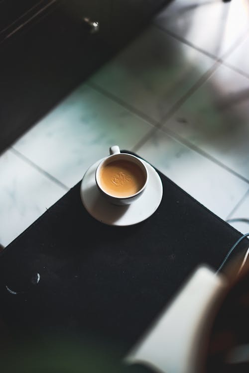 Cup of Coffee on Black Table