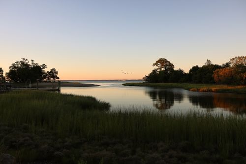 Free Beautiful sunrise at Cove Island Park, Stamford, showcasing nature's tranquility and reflection over the lake. Stock Photo