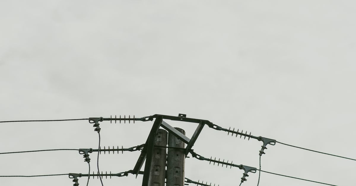 Post Below Image Black Electric Post Under White Sky · Free Stock Photo