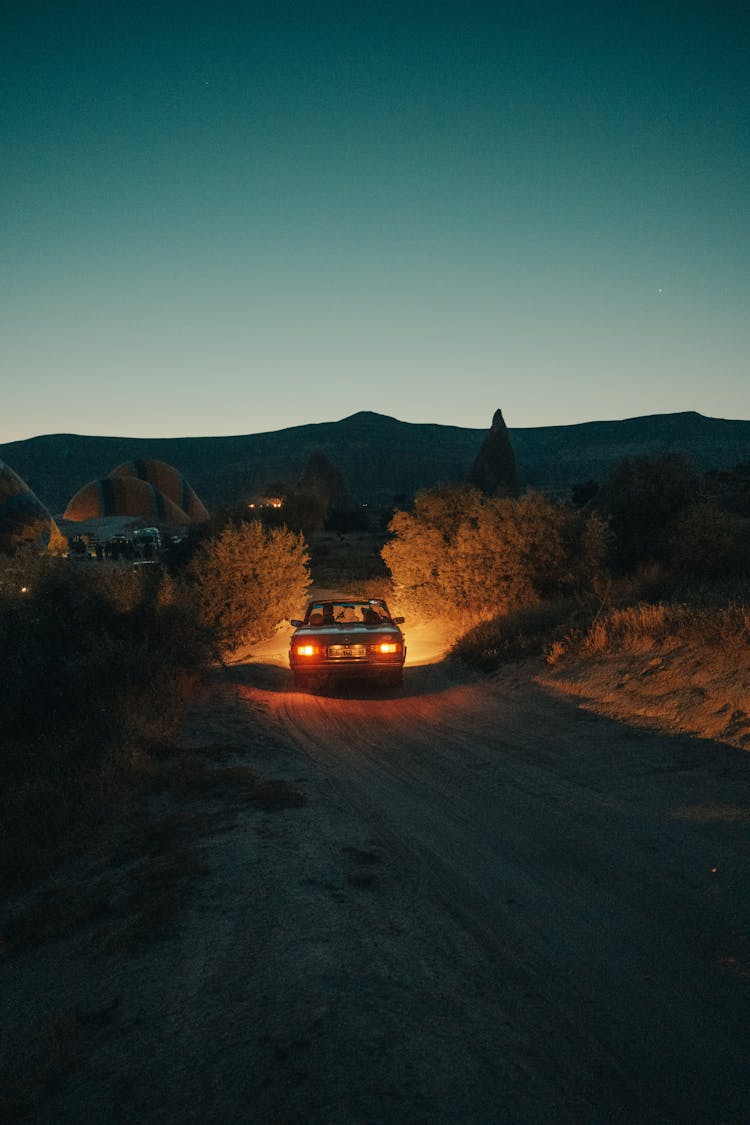 Car With Lights Driving Night Countryside