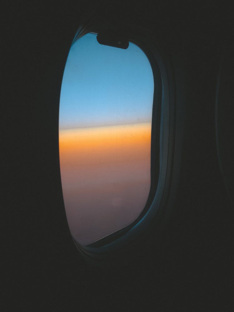 Airplane Window View Of White Clouds