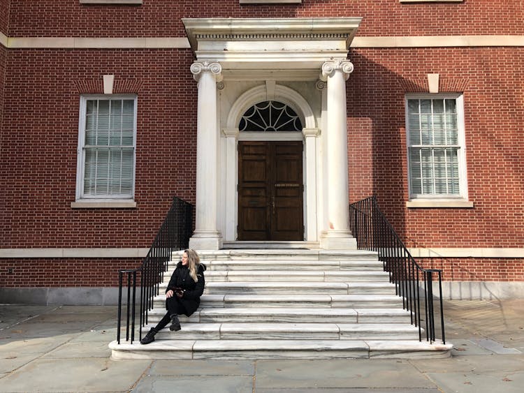 Woman Sitting On Steps