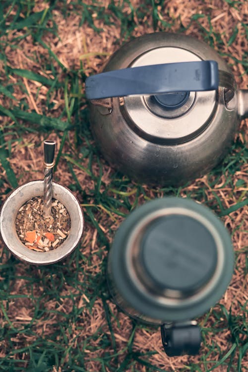 Thermos and Kettle on Grass