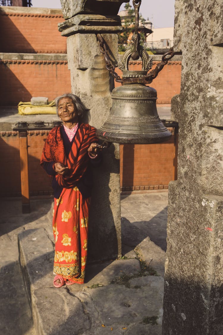 Woman Standing By Bell