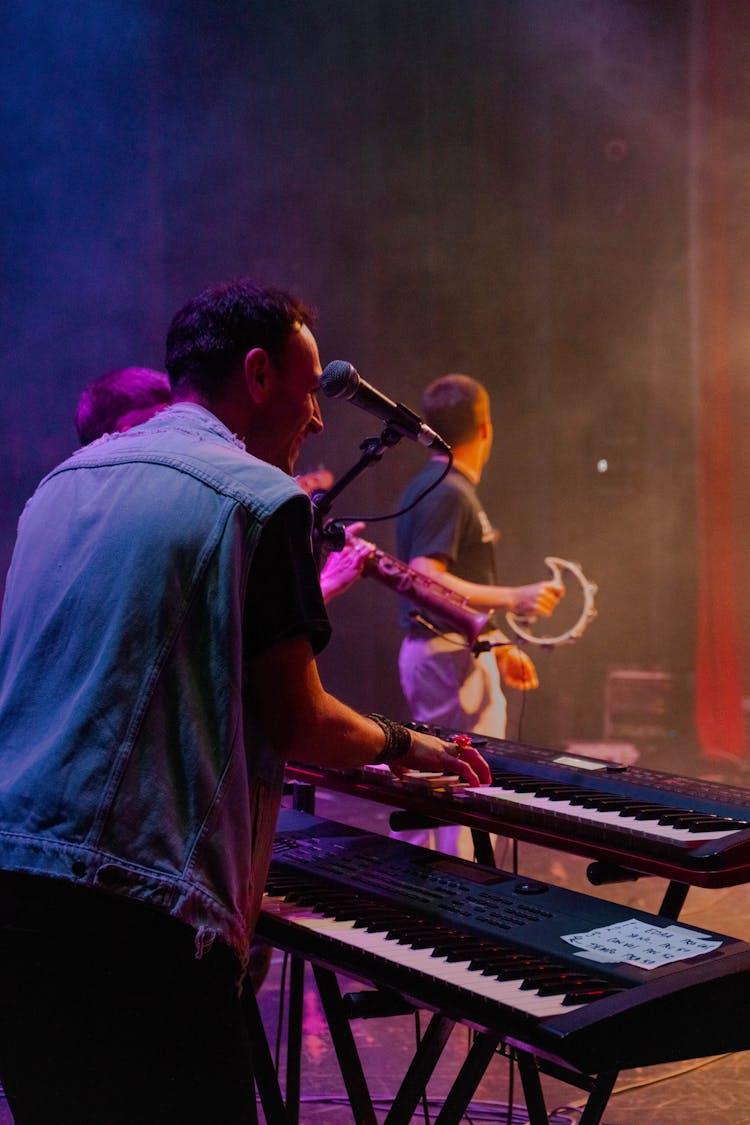 A Man Playing A Piano