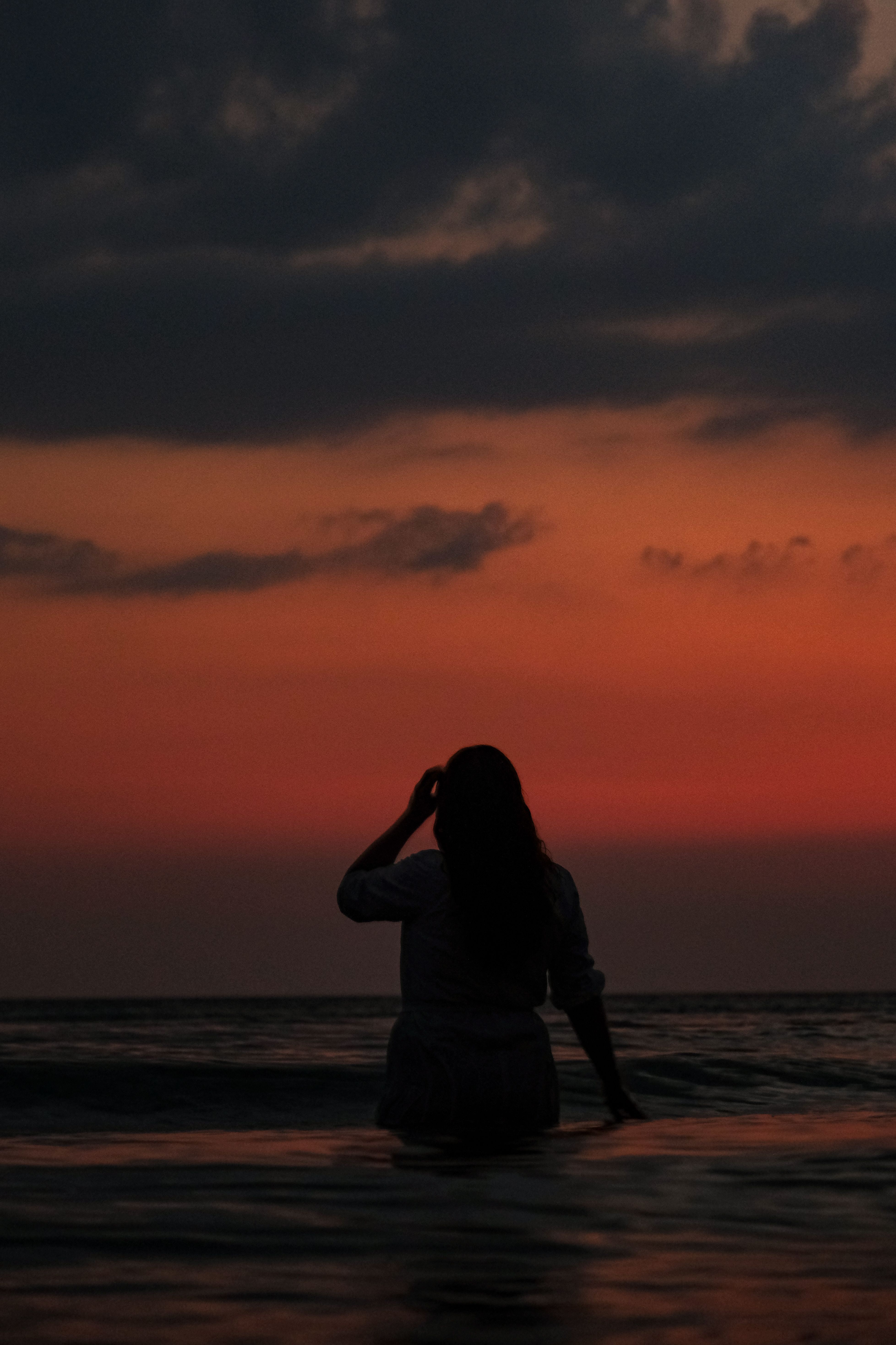 Silhouette of a Woman in the Sea · Free Stock Photo
