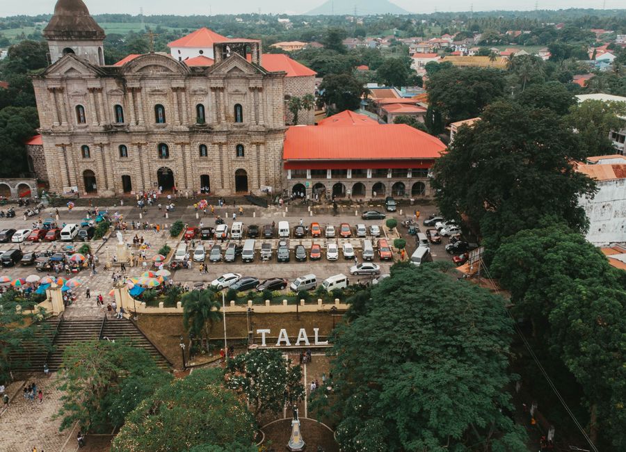 Stunning aerial view of Taal Basilica and surrounding town in the Philippines, showcasing historic architecture.