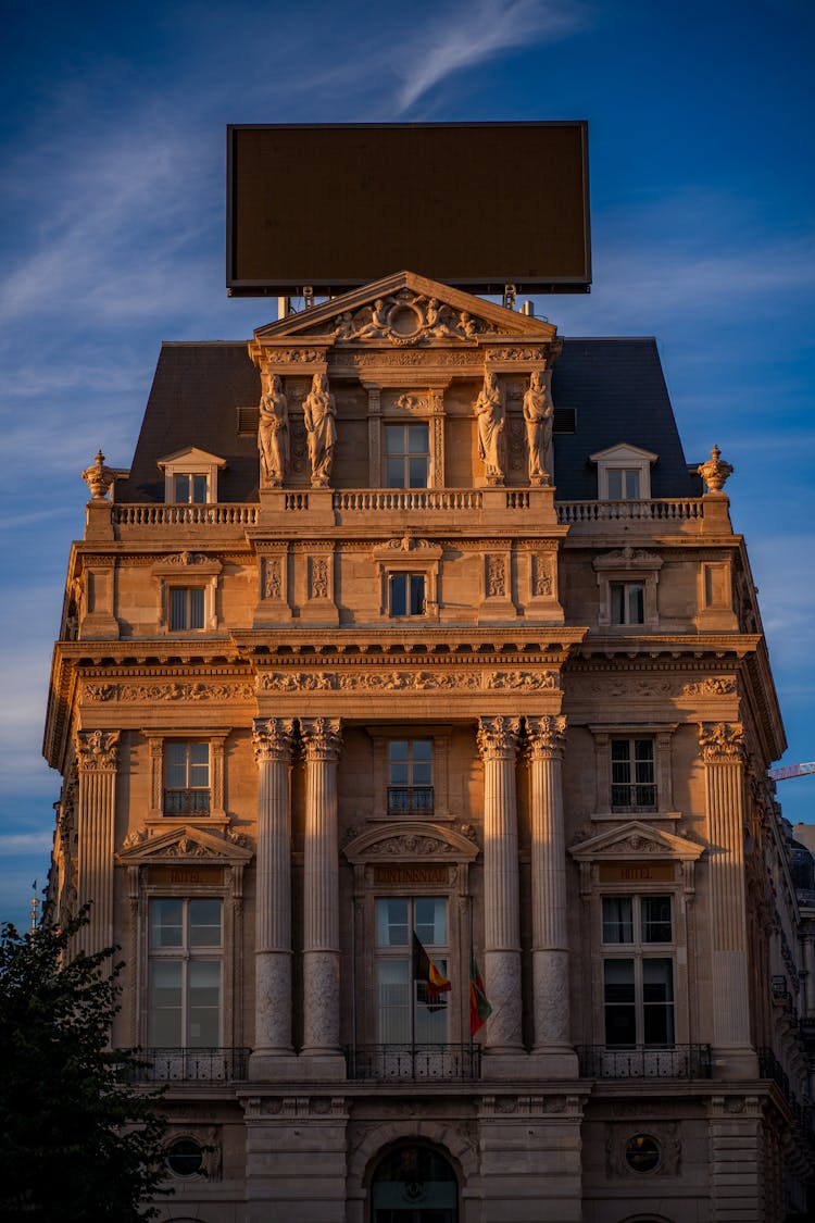 Brown Concrete Building Under Blue Sky