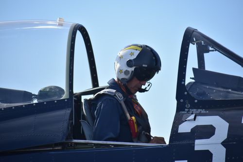 Free A military pilot in a fighter jet cockpit, ready for takeoff, wearing a helmet. Stock Photo