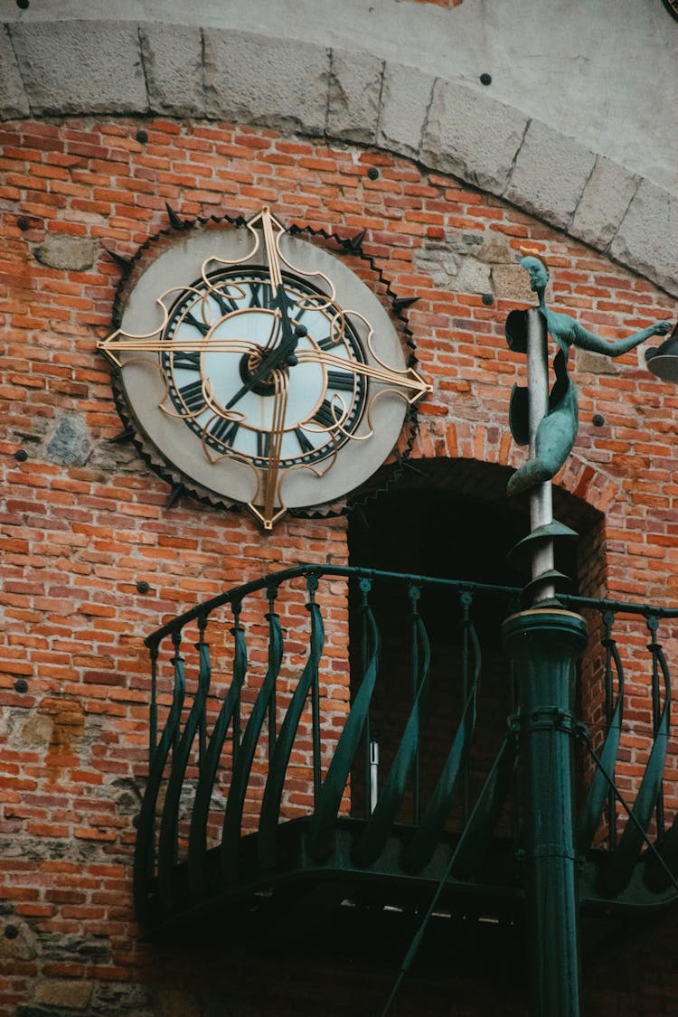 Analog Clock On Brick Wall