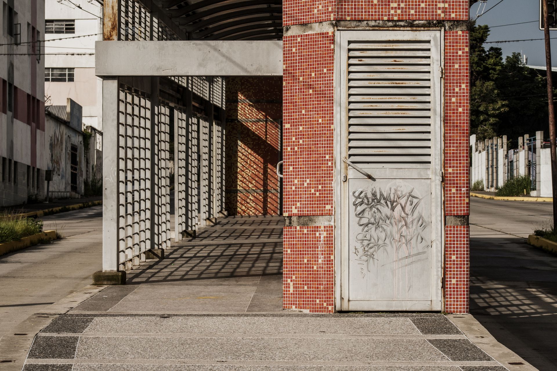 Vandalized Door on Tiled Wall