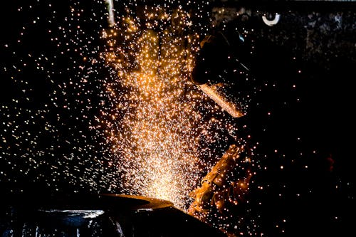 Sparkles around Working Welder