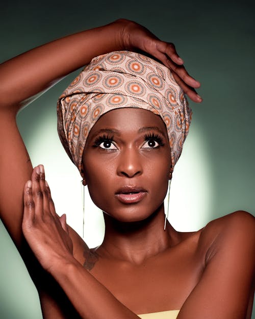 A Beautiful Woman Posing while Wearing Turban