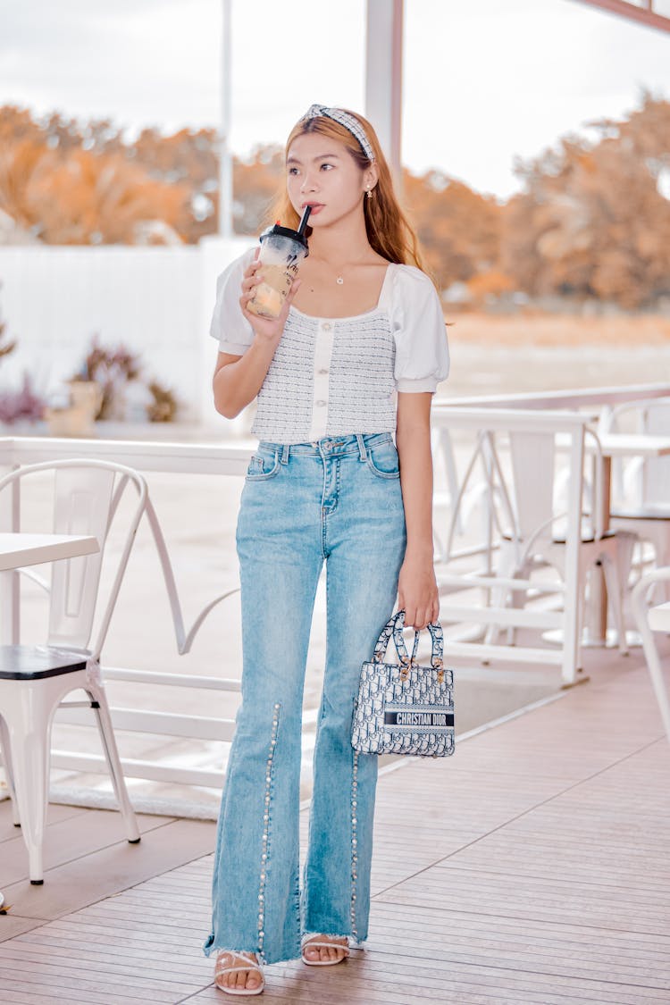 Girl With Drink On Cafe Outdoor Terrace