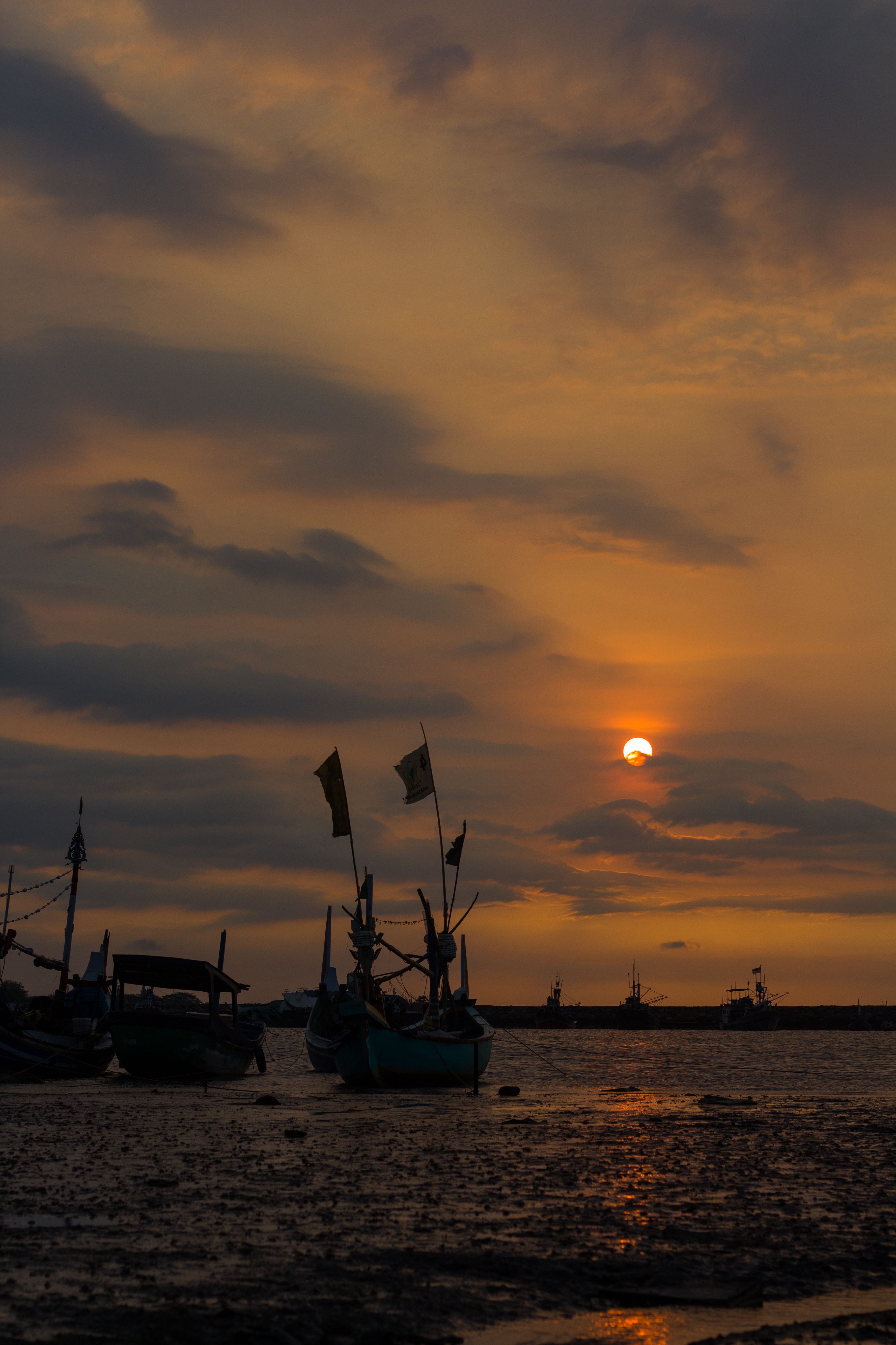 A Silhouette of Boats during the Golden Hour · Free Stock Photo