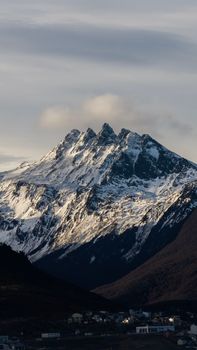 Breathtaking view of snow-capped Andes mountains in Ushuaia, Argentina, showcasing serene natural beauty.