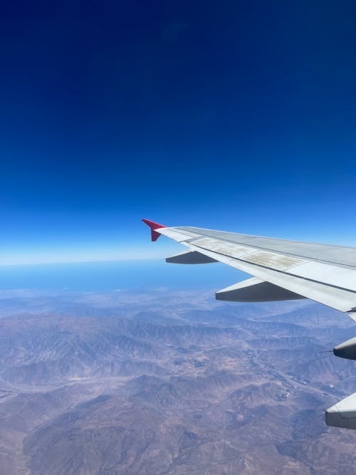An Airplane Wing in Blue Sky