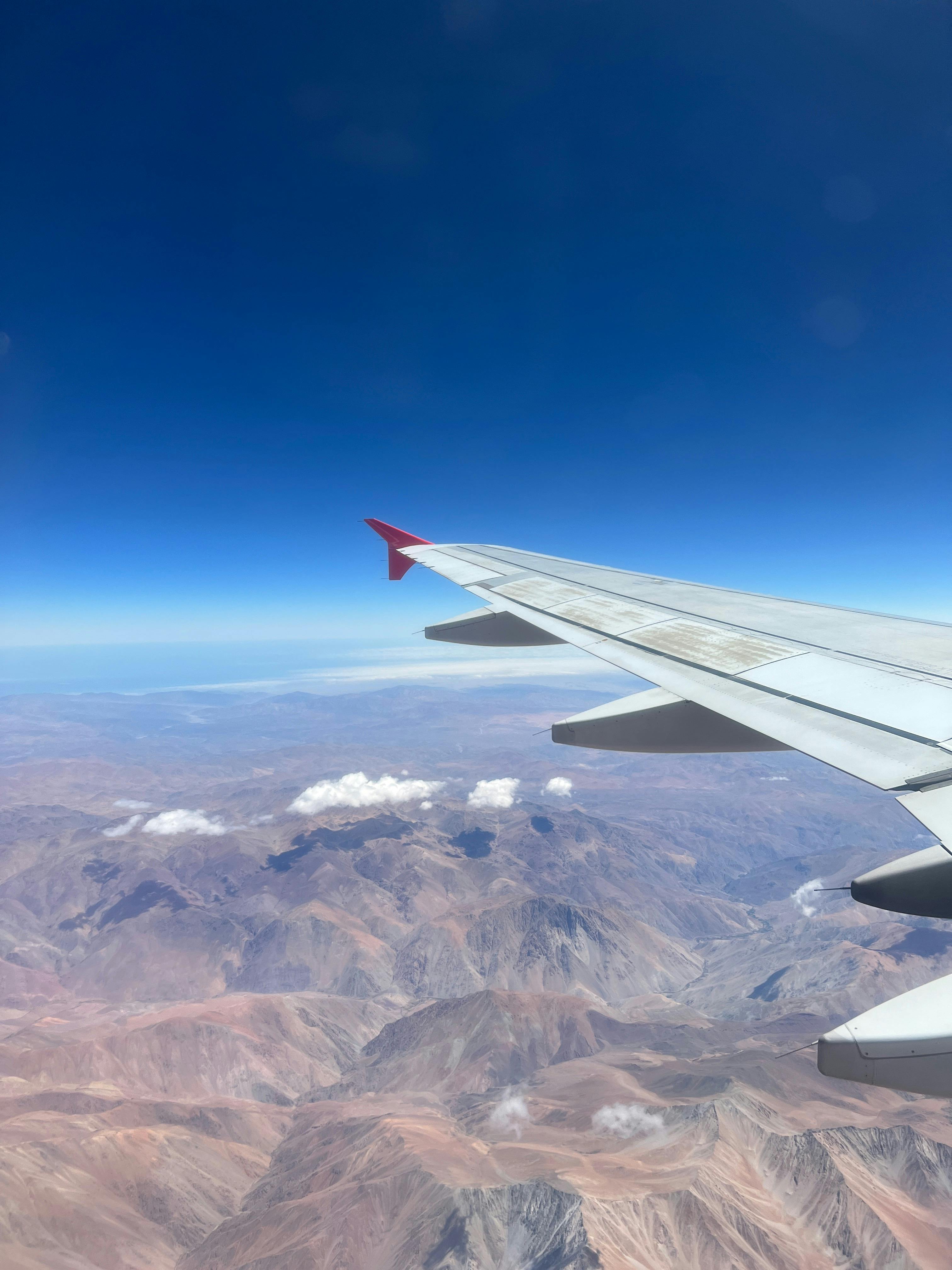 A breathtaking aerial view of the Atacama Desert seen from an airplane window.